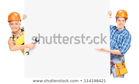 Stockfoto: A Female Construction Worker By A Billboard