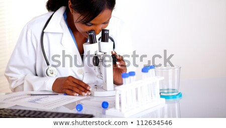 Сток-фото: Beautiful American Black Woman With A Microscope