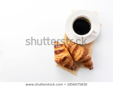 Foto d'archivio: Coffee With Croissant Against A White Background