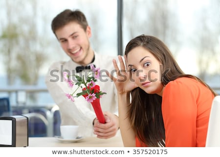 Foto stock: Couple On Unsuccessful Blind Date In Restaurant