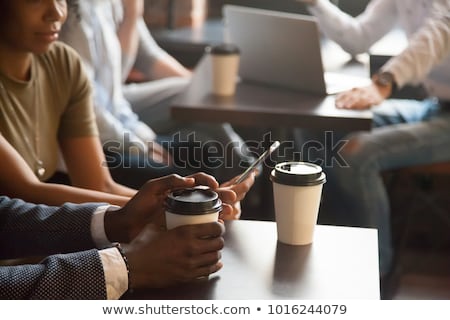 Stock photo: Businesswoman Drinking Coffee To Go And Talking On Mobile