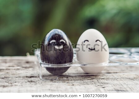 Imagine de stoc: Interracial Marriage Concept Black And White Egg As A Pair Of Different Races