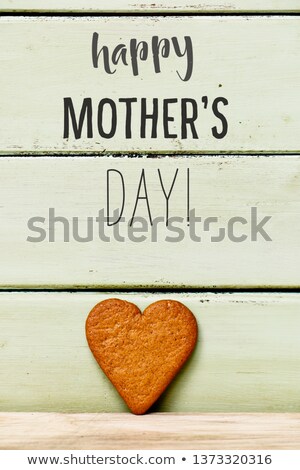 [[stock_photo]]: Heart Shaped Cookie On A Pale Green Background