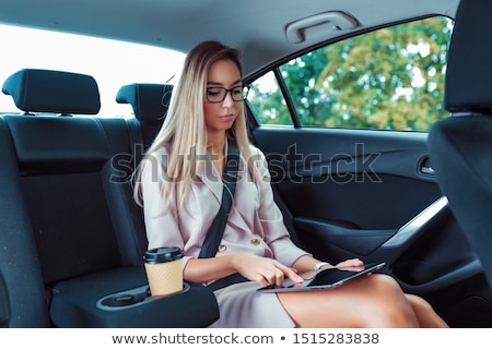 Stok fotoğraf: Executive Businesswoman In Car Work Touch Tablet