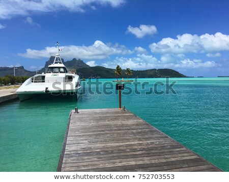 Foto stock: Over Water Bungalow With Steps Into Clear Ocean
