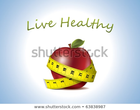 Stockfoto: A Pear And Applewith Measuring Tape Isolated On White Background
