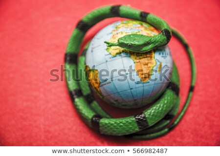 Stok fotoğraf: Cobra On A Red Christmas Bauble