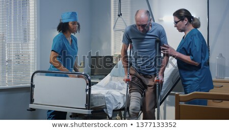 Stock fotó: African Man With Crutches Trying To Walk