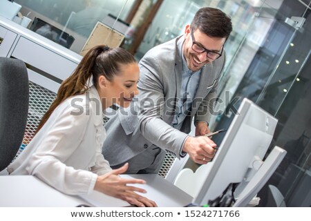 Stockfoto: Businessman Is Showing Something On A Computer