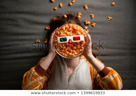 Stock photo: Close Up Of Teenage Girls Eating Popcorn At Home