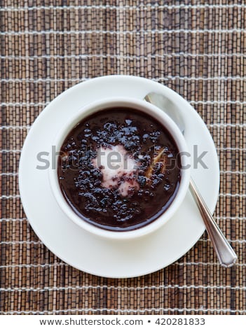 Сток-фото: Black Sticky Rice Pudding With Coconut Milk In White Bowl Wooden Background