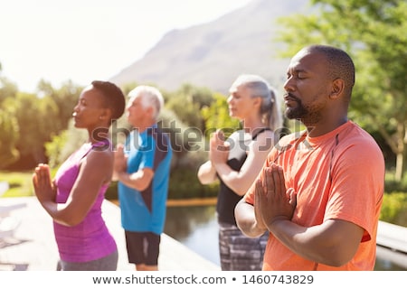 Stockfoto: Woman Doing Yoga Exercise Outdoors
