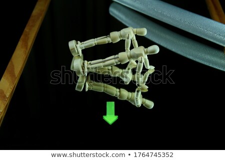 Stockfoto: Wooden Figurine Exercising On Floor