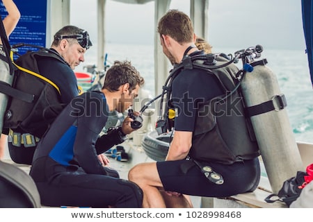 Foto stock: Diver Preparing To Dive Into The Sea