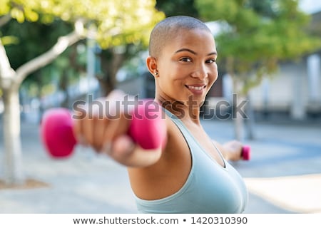 Stockfoto: Portrait Of A Cheerful Overweight Fitness Woman
