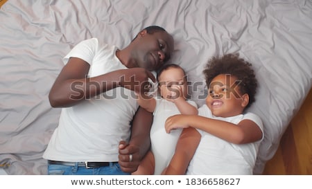 Stok fotoğraf: Happy Father With Preteen And Baby Son At Home