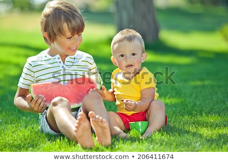 Stock photo: Group Of Babies Eating Watermelon Outdoors