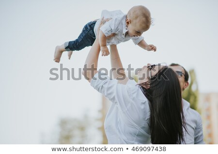 Сток-фото: Three Girls Lying On Their Back On The Grass In A Park