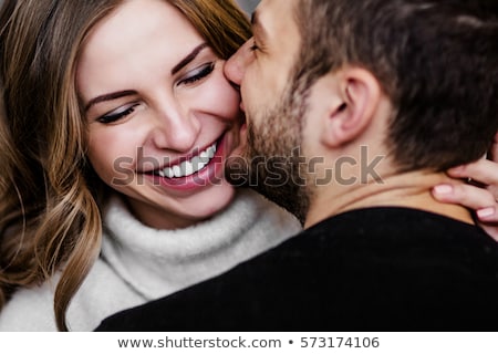 Foto stock: Young Beautiful Couple Hugging And About To Kiss