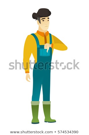 Foto stock: Disappointed Asian Farmer With Thumb Down
