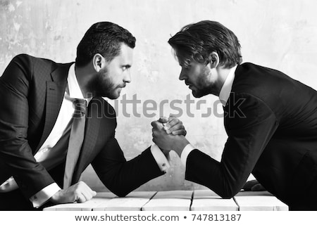 Stockfoto: Arm Wrestling In Group Meeting