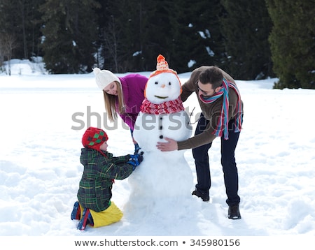 Сток-фото: Father And Son Building A Snowman