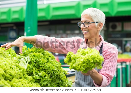 Сток-фото: Senior Woman Sells Lettuce On Marketplace