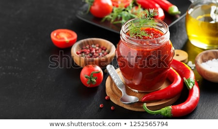 Stock photo: Homemade Olive Oil With Tomatoes And Chilli