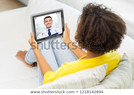 Stockfoto: Patient Having Video Chat With Doctor On Tablet Pc