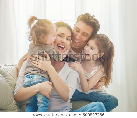 Stockfoto: Happy Family Mother Father And Two Children At Home