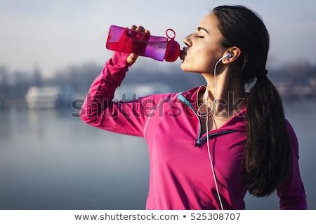 Foto stock: Sports Person Drinking Water From Bottle