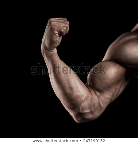 Stockfoto: Strong And Handsome Young Bodybuilder Demonstrate His Muscles An