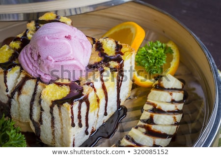 Stockfoto: Honey Toast And Banana Wtih Dry Ice On Table Background