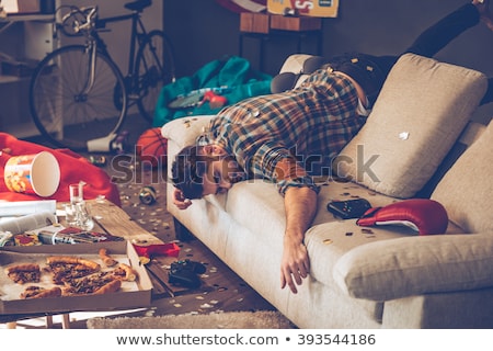 Foto d'archivio: The Young Drunk Handsome Man After Party At Home