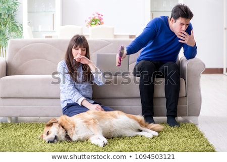 Сток-фото: Man Having Allergy From Dog Fur