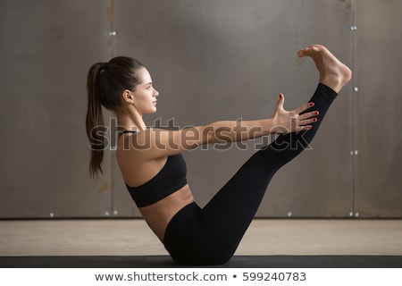 Stock photo: Woman Doing Ashtanga Vinyasa Yoga Asana Navasana - Boat Pose