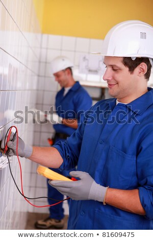 Сток-фото: Two Electricians Inspecting Electrical Power Supply