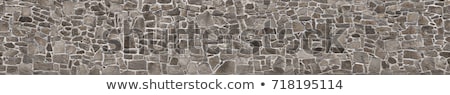 Foto stock: Stone Wall With Abstract Pattern