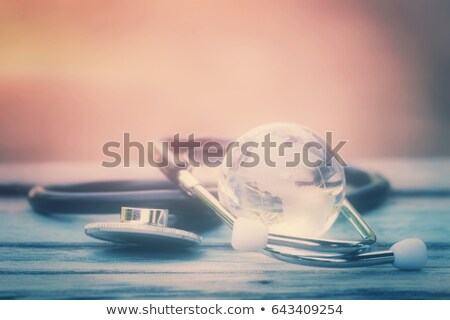 Foto stock: Stethoscope On A World Map Furnished By Nasa