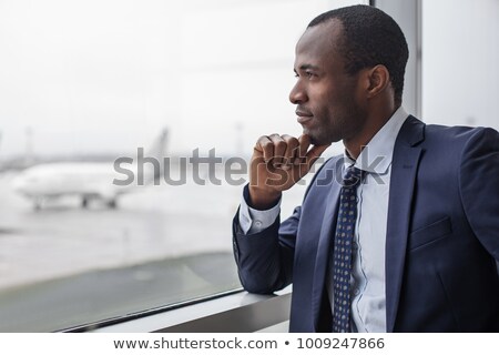 Stok fotoğraf: Profile Of Thoughtful Attractive Businessman Thinking And Touching His Chin
