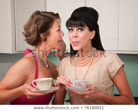Сток-фото: Two Women Gossiping On The Kitchen