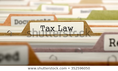 Foto stock: Folder In Catalog Marked As Tax Law