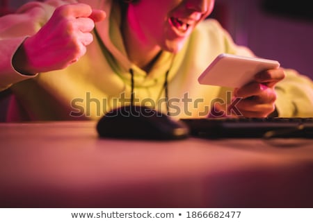 Stok fotoğraf: Cropped Image Of Cheerful Gamer Playing Video Games On Computer