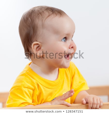Stockfoto: One Years Girl Baby On The Side Of The Bed