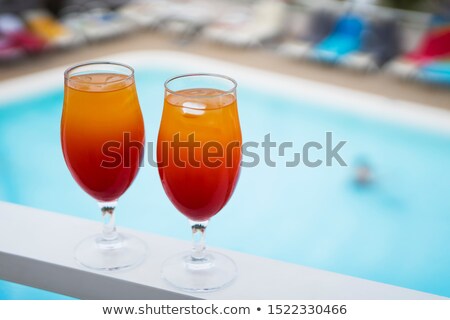 Сток-фото: Two Glasses Of White Wine In Bed On The Blurred Background