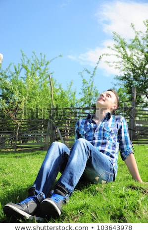 Young Teen Boy Looking Out Of A Fence Imagine de stoc © mirc3a