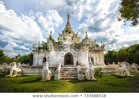 [[stock_photo]]: White Pagoda At Inwa City With Lions Guardian Statues Myanmar