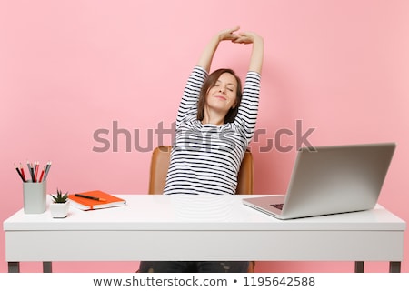 Stock photo: Woman Sitting At The Table With Closed Eyes