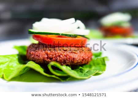 Stockfoto: Meat Patty On Lettuce Leaves