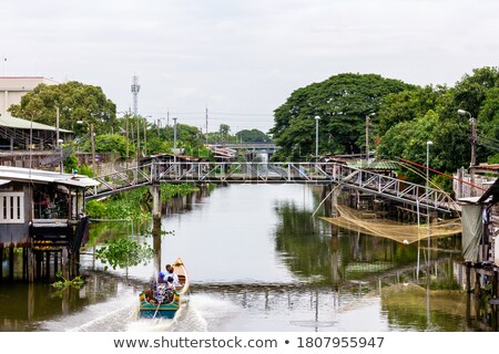 Imagine de stoc: Three Old Boats Along The River